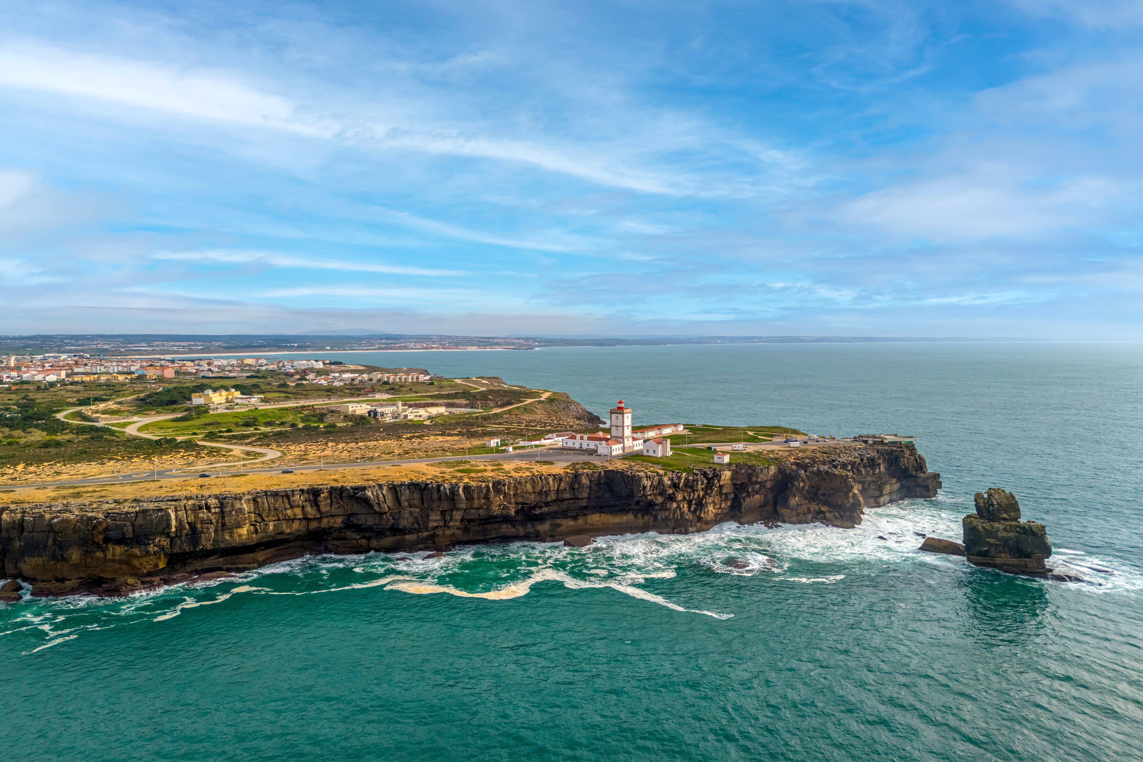 Outdoor pool area surrounded by pines