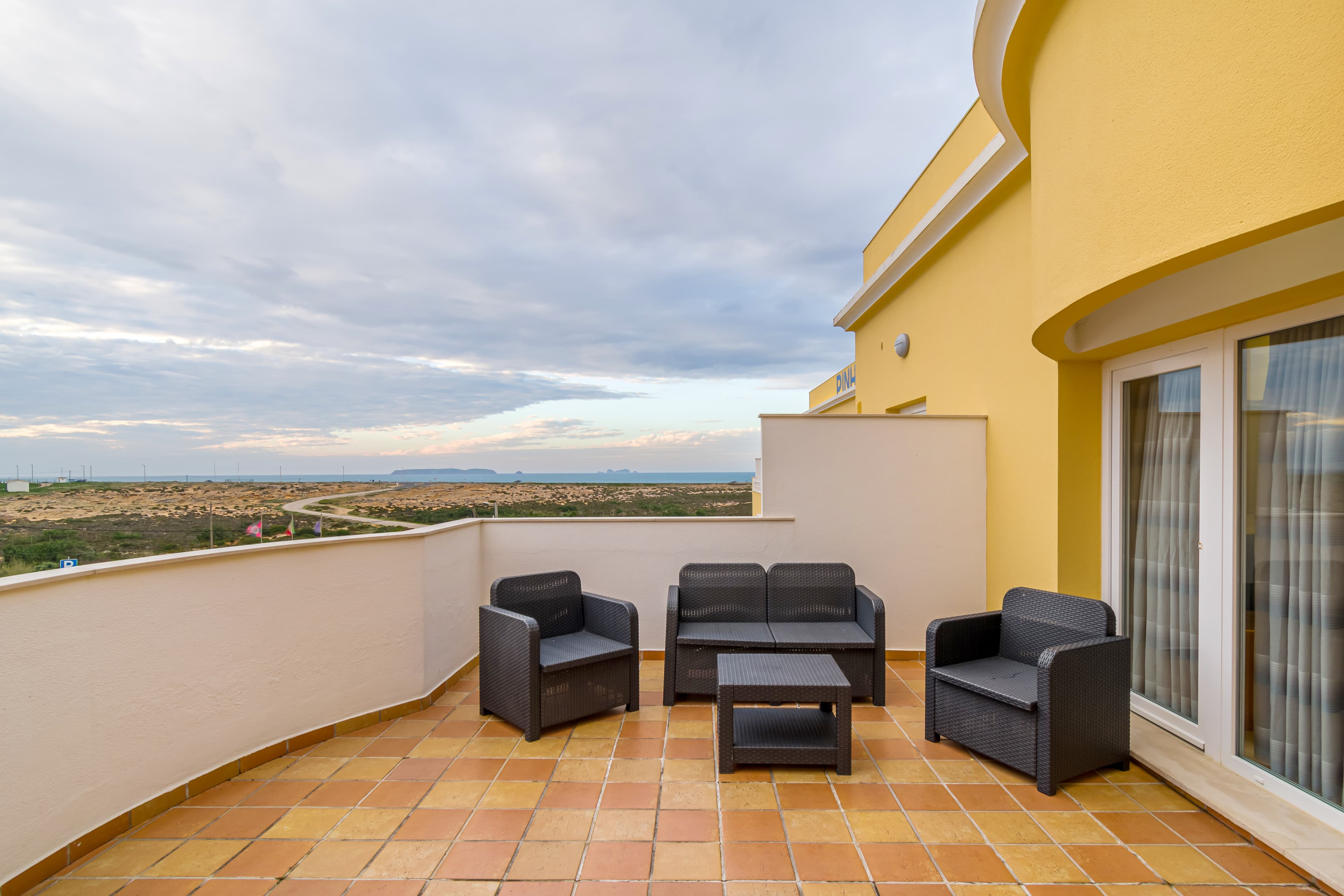 Private balcony lounge overlooking the coast